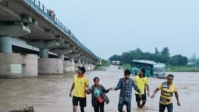 Bus full of Nepali passengers stuck in river, rescued and taken out