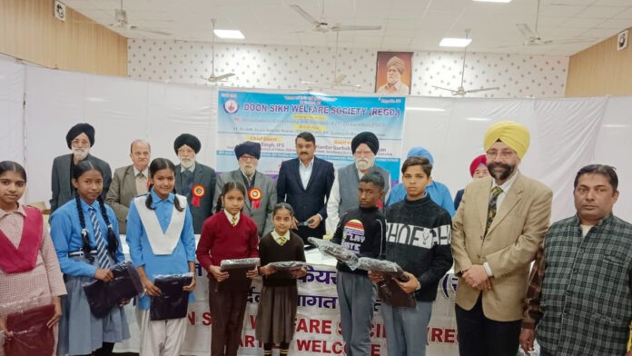 Doon Welfare Society distributed sweaters on the foundation day